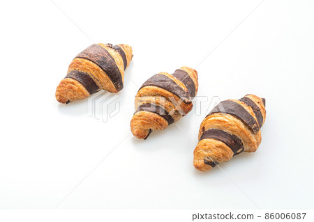 fresh croissant with chocolate 86006087