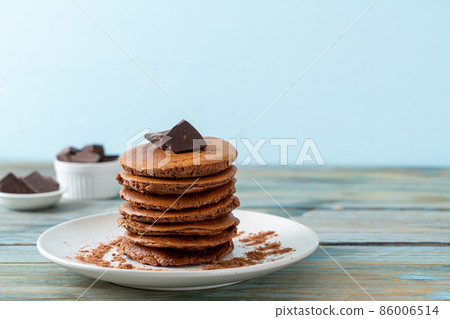 chocolate pancake stack on plate 86006514
