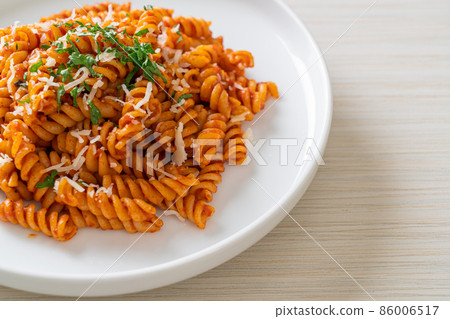 spirali or spiral pasta with tomato sauce spirali or spiral pasta with tomato sauce 86006517