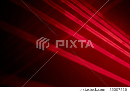Bright red neon laser lights illuminate the darkness creating lines and triangle shapes in sci-fi effect. 86007216