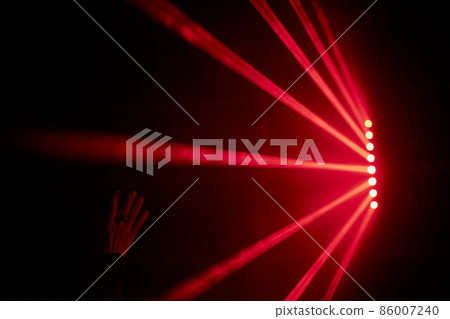 Bright red neon laser lights illuminate the darkness creating lines and triangle shapes in sci-fi effect. Bright red neon laser lights illuminate the darkness creating lines and triangle shapes in sci-fi effect. 86007240