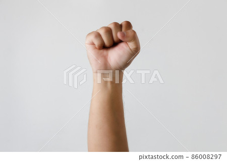Man fist up isolated on white background success or strength Man fist up isolated on white background success or strength 86008297