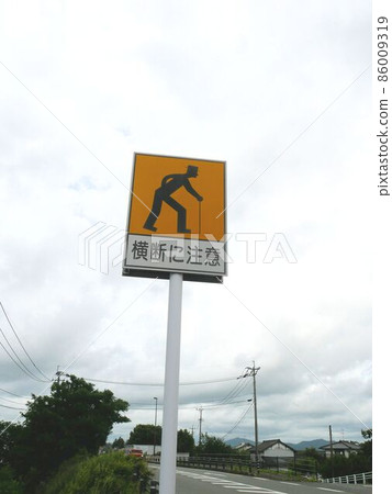 Old man crossing caution sign 86009319