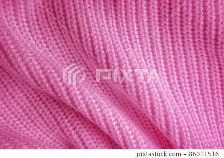 Soft knitted sweater texture closeup. Abstract light violet pink background. The trendy backdrop for web design. Luxury fabric backplate pattern 86011516