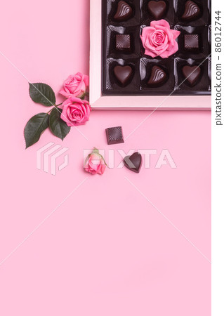 Valentines day concept . Chocolate food gifts and pink roses on pink background. Flat lay. 86012744
