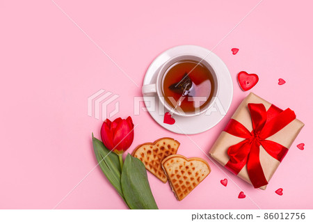 Valentine's Day breakfast in bed. Gift, tea Belgian waffles flower, , hearts on pink background. Valentines day concept. 86012756