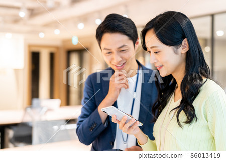 Business person working in the office shooting cooperation "+ SHIFT NO GIZAKA" 86013419