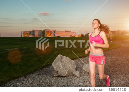Running woman. Runner jogging in sunny nature. Running woman. Runner jogging in sunny nature. 86014328
