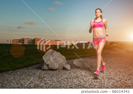 Running woman. Runner jogging in sunny nature. Running woman. Runner jogging in sunny nature. 86014341