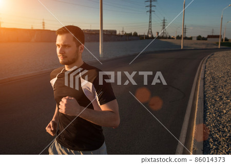 Close-up portrait of athletic man running Close-up portrait of athletic man running 86014373