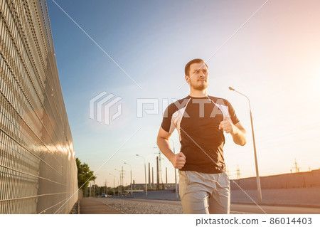 Close-up portrait of athletic man running Close-up portrait of athletic man running 86014403