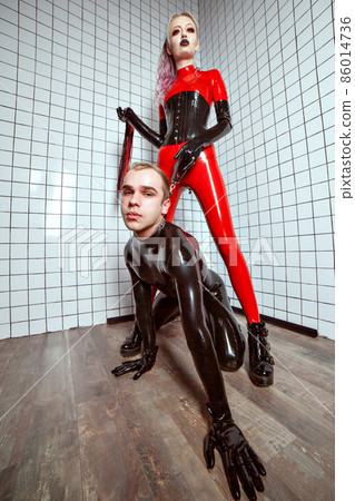 Fashion trend of latex clothing for women and men. 86014736