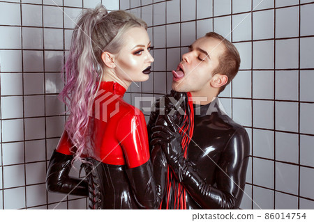 Fashion trend of latex clothing for women and men. 86014754
