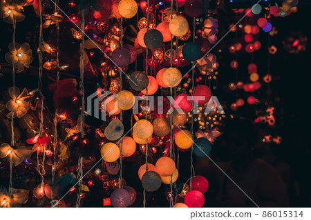 A bunch of colorful decorative lights linked together and sold in Chatuchak Weekend Market in Bangkok Thailand as tourist souvenirs A bunch of colorful decorative lights linked together and sold in Chatuchak Weekend Market in Bangkok Thailand as tourist souvenirs 86015314