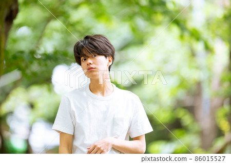 Young male portrait fresh green 86015527