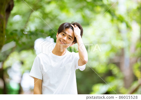 Young male portrait fresh green 86015528