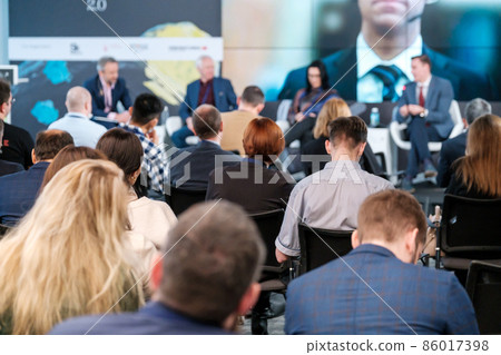 People sitting in conference room 86017398