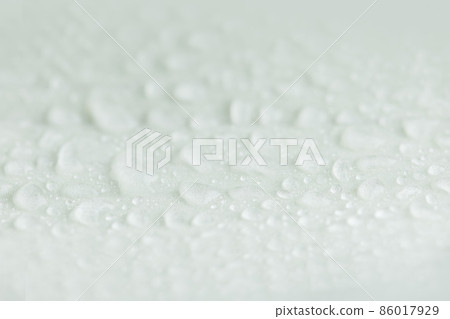 Water drops on a white background. 86017929