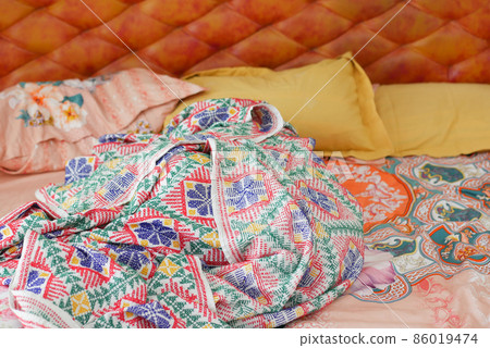 messy bed in early morning , messy bed after waking up  86019474