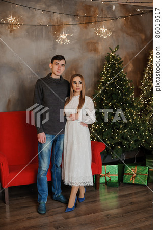 boy and girl hugging on the background of the Christmas tree 86019517