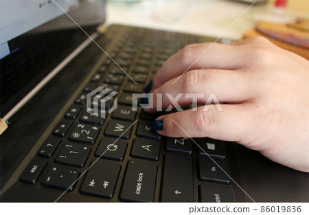 Woman is writing on her black notebook Woman is writing on her black notebook 86019836