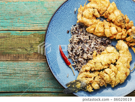 Deep fried sea bass with rice. Deep fried sea bass with rice. 86020019