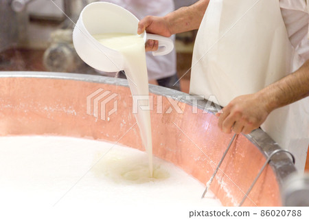 Parmesan cheese prduction process in Bologna Italy Parmesan cheese prduction process in Bologna Italy 86020788