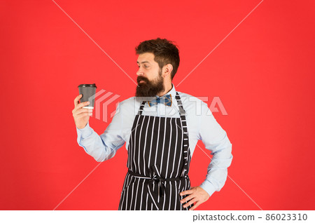 Hipster barista hold cup fresh brewed drip coffee.  86023310