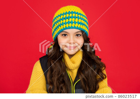 express positive emotion. winter fashion. smiling kid with curly hair in hat. teen girl 86023517