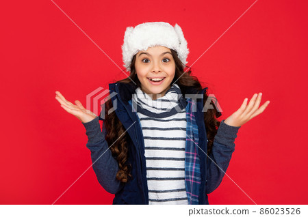 portrait of child wearing warm clothes. express positive emotion. winter fashion. amazed kid 86023526