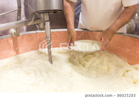 Parmesan cheese prduction process in Bologna Italy Parmesan cheese prduction process in Bologna Italy 86025283