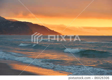 Beautiful Nature Background.Amazing Colorful Clouds.Water Reflections.Magic Artistic Wallpaper.Creative Photography.Orange Sky.Mountain Landscape.Tranquil Panorama.Yellow Color.Summer Sunset Sea. Beautiful Nature Background.Amazing Colorful Clouds.Water Reflections.Magic Artistic Wallpaper.Creative Photography.Orange Sky.Mountain Landscape.Tranquil Panorama.Yellow Color.Summer Sunset Sea. 86026306
