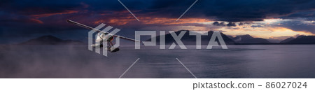 Seaplane Aircraft Flying over the Pacific Ocean Coast. 86027024