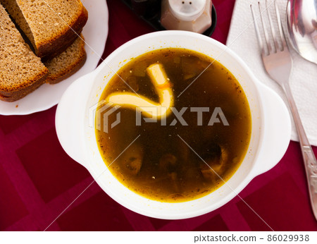 Popular dish of Russian cuisine is mushroom soup Popular dish of Russian cuisine is mushroom soup 86029938