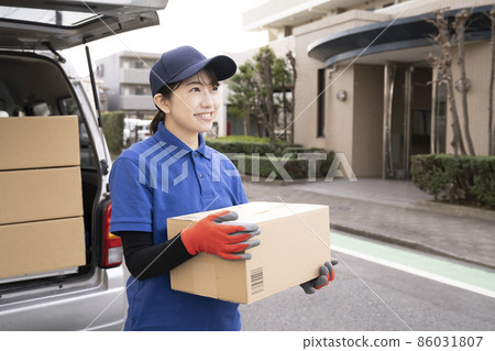 Courier woman delivering luggage Courier woman delivering luggage 86031807