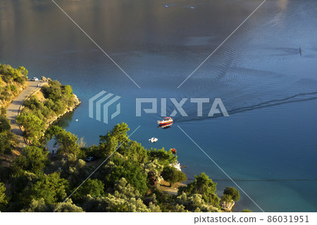 Beautiful bay and seaside with a yacht at sea. Sea travel concept Beautiful bay and seaside with a yacht at sea. Sea travel concept 86031951