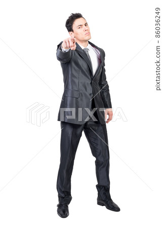 Serious man pointing to camera. White background. Serious man pointing to camera. White background. 86036249
