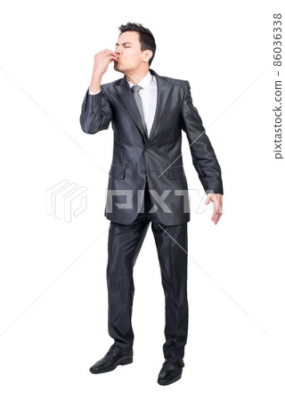 Male manager delighting delicious food taste. White background. Male manager delighting delicious food taste. White background. 86036338