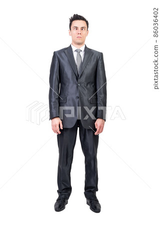 Funny businessman squinting against white background. White background. 86036402
