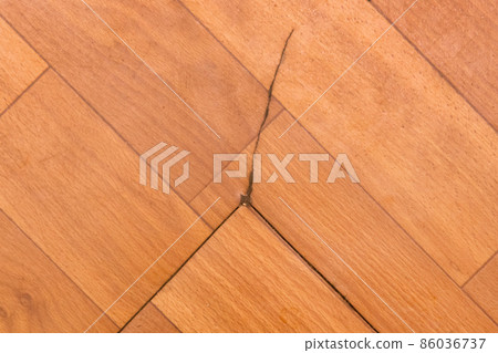 Broken torn linoleum old rubber polymer PVC floor damage material, flooring repair Broken torn linoleum old rubber polymer PVC floor damage material, flooring repair 86036737