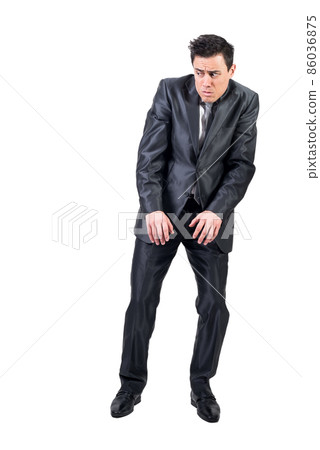 Afraid man in light studio. White background. 86036875