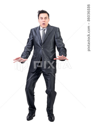Terrified man in light studio. White background. 86036886
