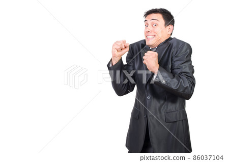 Cheerful businessman in formal wear celebrating success Cheerful businessman in formal wear celebrating success 86037104