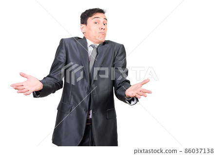 Confused male entrepreneur in suit with raised hands 86037138