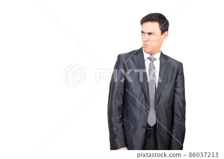 Elegant man with disgusted face in studio Elegant man with disgusted face in studio 86037213