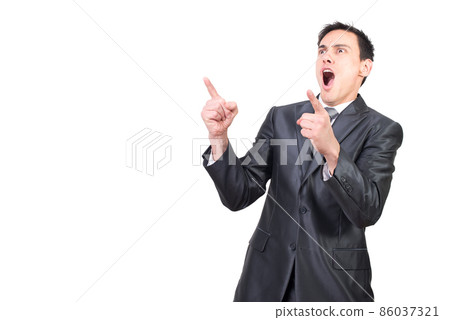 Confident businessman pointing away and screaming after successful deal Confident businessman pointing away and screaming after successful deal 86037321