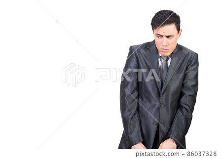 Scared shy man looking away in white studio 86037328