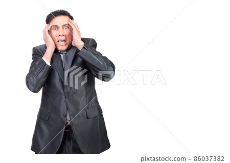 Scared man touching head and looking at camera 86037382