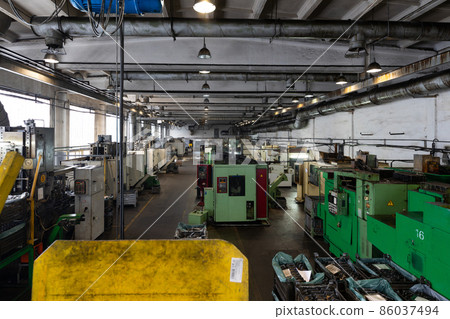 Photo of modern automatic automobile manufacturing workshop. Factory with steel constructions. Plant Photo of modern automatic automobile manufacturing workshop. Factory with steel constructions. Plant 86037494