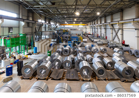 Photo of production line of metal tile for roof. Steel forming machine in metalwork factory workshop 86037569